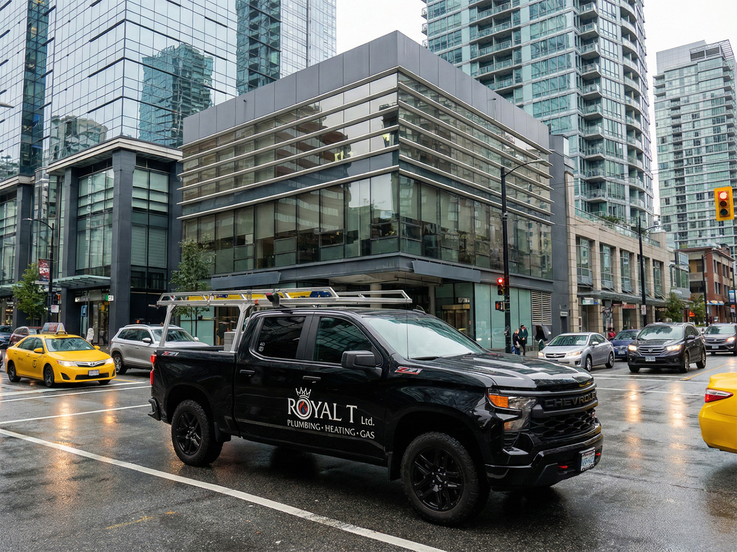 Royal T Plumbing work truck parked on a busy Vancouver city street, showcasing plumbing, heating, and gas services.